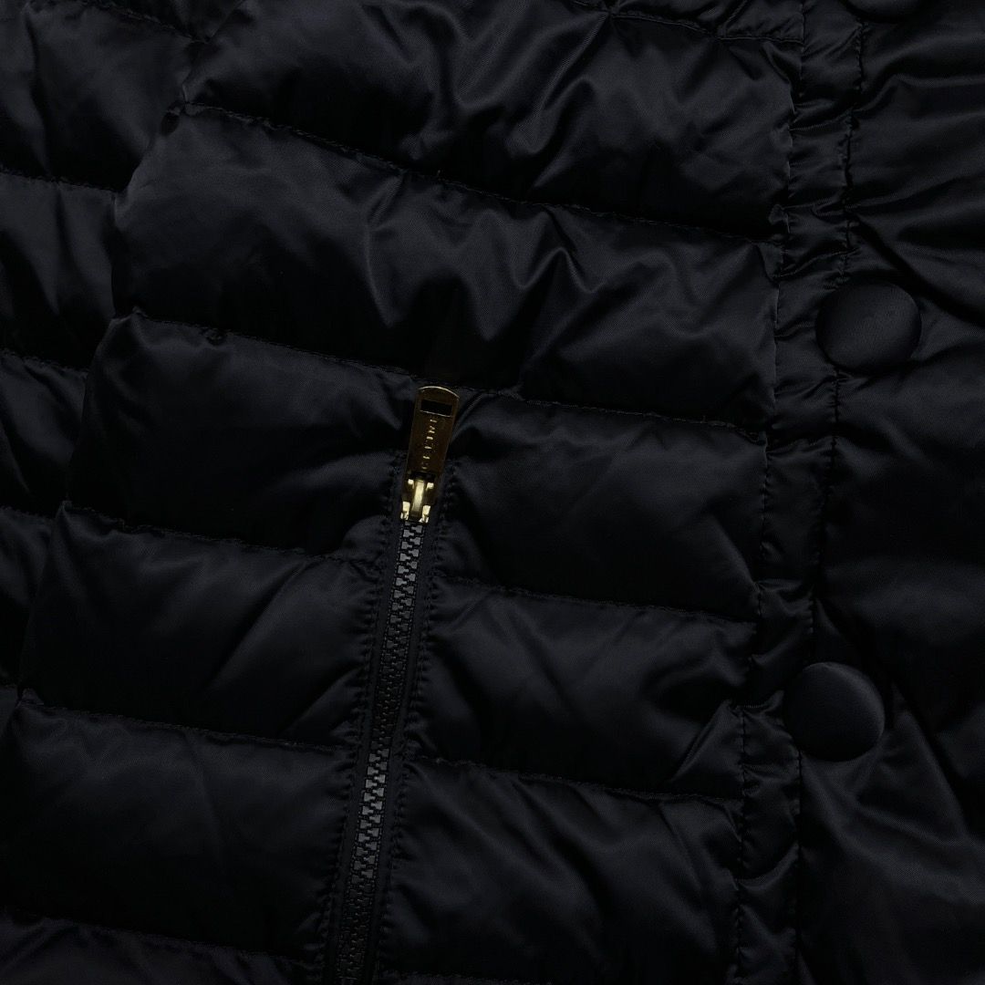 Celine Paris Black Puffer Jacket (Category: Coats, Jackets and Outerwear) located in Caloocan City. Submitted by achilles_grails (Listing ID 1470580240, Image 3). Description: Celine puffer jacket in black. Size 38 label inside. Quilted design with high collar and covered double-breasted button closure. Zip pockets on both sides with gold-tone hardware. YKK VSLON zippers. Warm quilted nylon material..
