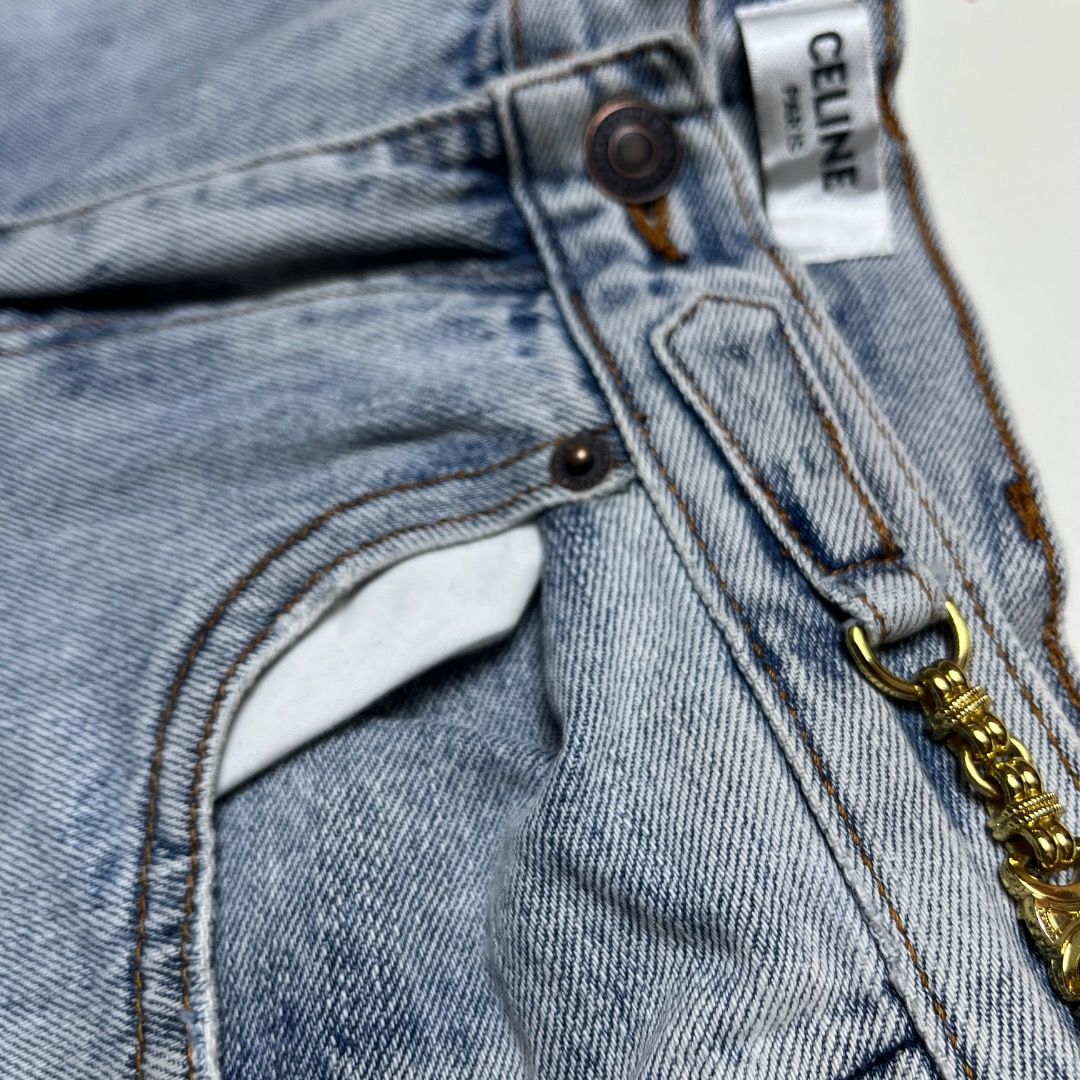 Celine Paris Light Wash Denim Jeans (Category: Jeans) located in Caloocan City. Submitted by achilles_grails (Listing ID 1470574769, Image 3). Description: - Brand: Celine Paris - Material: 100% Cotton, Made in Italy - Color/Wash: Light blue, clean vintage wash - Fit: Mid-rise, straight leg - Details: Built-in gold chain on waistband loop, branded bronze-tone button closure - Pockets: Classic five-pocket design - Care: Hand wash cold only - Condi