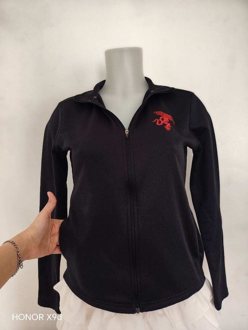Champion Black Zip-Up Jacket with Red Embroidery (Category: Coats, Jackets and Outerwear) located in Mabalacat. Submitted by Jackikay.PreLoved (Listing ID 1470602766, Image 2). Description: - Brand: Champion - Item: Black Full-Zip Jacket - Size: S on tag - Material: 100% polyester with soft fleece interior lining - Features: High collar, 2 side pockets, 2 side inner pockets, and red embroidered graphic on the left chest - Origin: Made in Jordan.