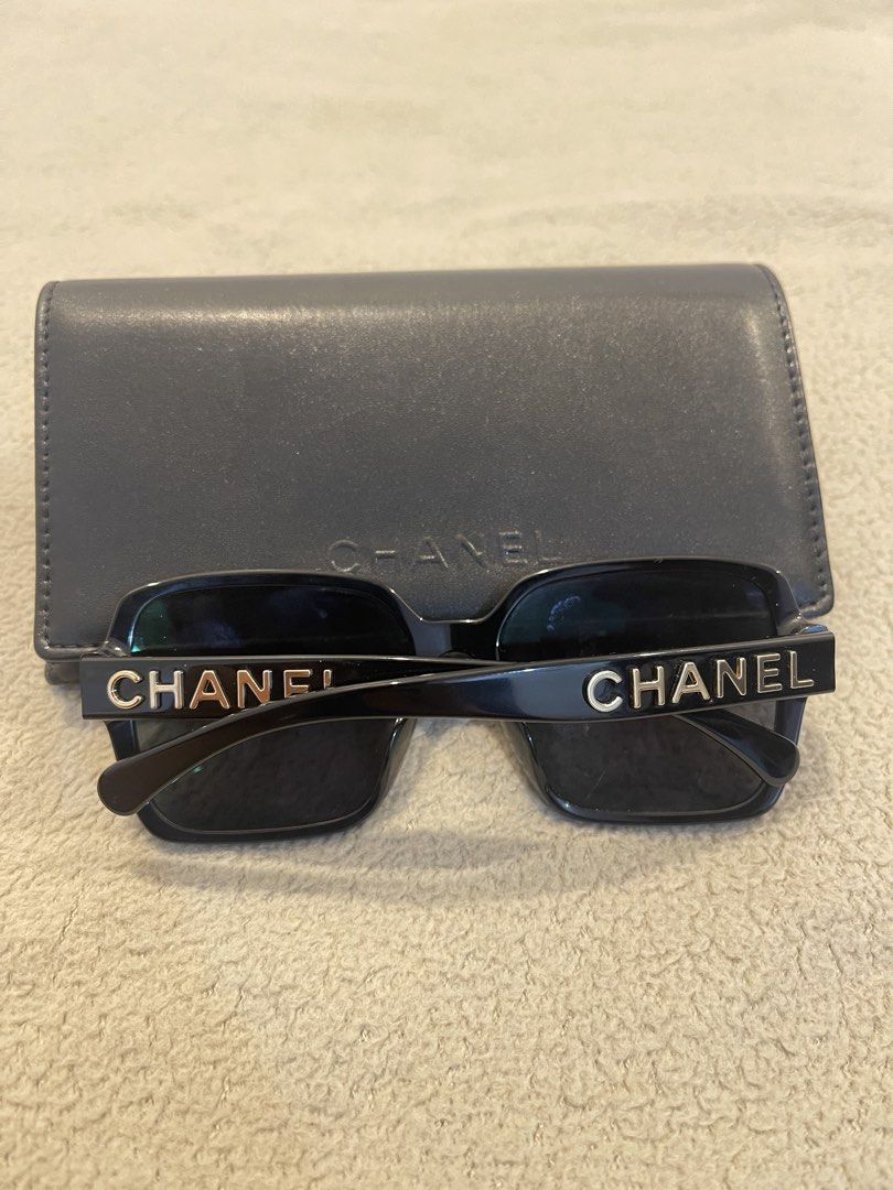 Chanel 5408-A Black Sunglasses with Case (Category: Sunglasses & Eyewear) located in Muntinlupa City. Submitted by aa0531_ (Listing ID 1470689322, Image 2). Description: - Brand: Chanel - Model: 5408-A - Color: Black frames with dark grey lenses - Details: Bold Chanel lettering along the temples - Origin: Made in Italy - Condition: Clean, ready-to-wear with no heavy scratches on frames or lenses - Inclusion: Original dark leatherette case with em