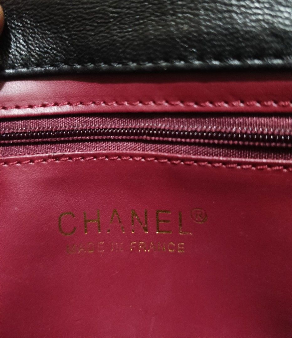 Chanel Black Quilted Leather Handle Flap Bag (Category: Luxury Bags & Wallets) located in Quezon City. Submitted by lootsniwoah_12 (Listing ID 1470630724, Image 3). Description: - Brand: Chanel - Style: Classic flap top handle bag - Material: Black quilted lambskin leather - Hardware: Gold-tone with iconic CC turn-lock closure - Strap/Handle: Short braided chain and leather top handle - Interior: Burgundy lining with a secure zipper pocket - Auth