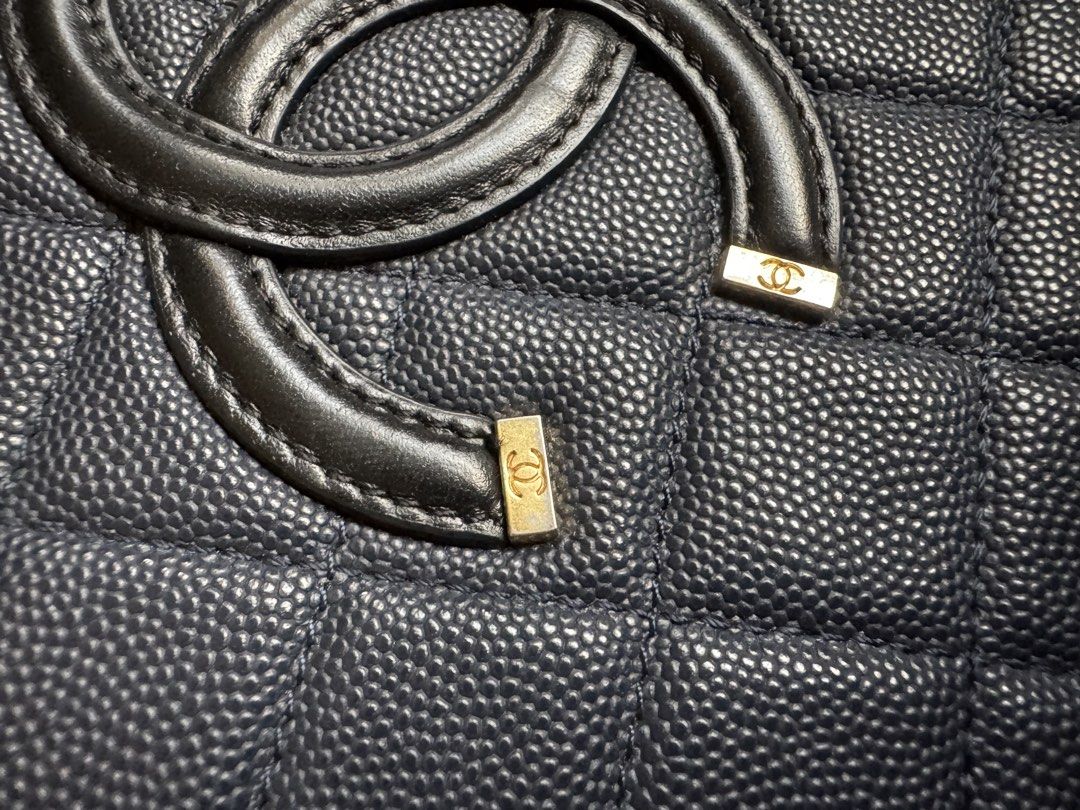 Chanel Black Quilted Vanity Case Handbag (Category: Luxury Bags & Wallets) located in Cauayan City . Submitted by espiritucj (Listing ID 1470678754, Image 3). Description: Thrifted Black quilted caviar leather vanity case by Chanel. Top handle design paired with a chain strap woven in leather. Gold-tone hardware with engraved CC logos on the zipper pull and hardware feet. Interior lined in black fabric with zipper pocket. Serial sticker attached 