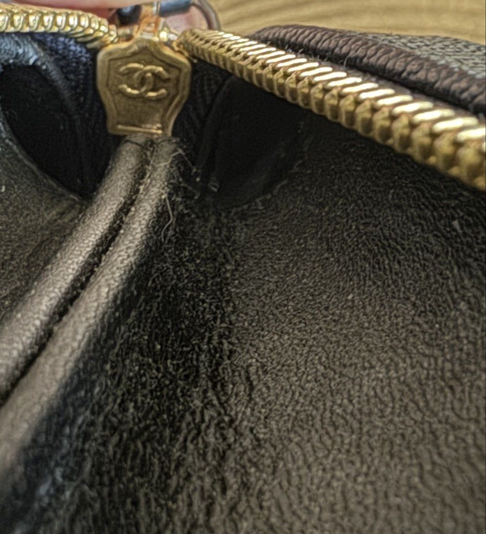 Chanel Black Quilted Vanity Case Handbag (Category: Luxury Bags & Wallets) located in Cauayan City . Submitted by espiritucj (Listing ID 1470678754, Image 2). Description: Thrifted Black quilted caviar leather vanity case by Chanel. Top handle design paired with a chain strap woven in leather. Gold-tone hardware with engraved CC logos on the zipper pull and hardware feet. Interior lined in black fabric with zipper pocket. Serial sticker attached 