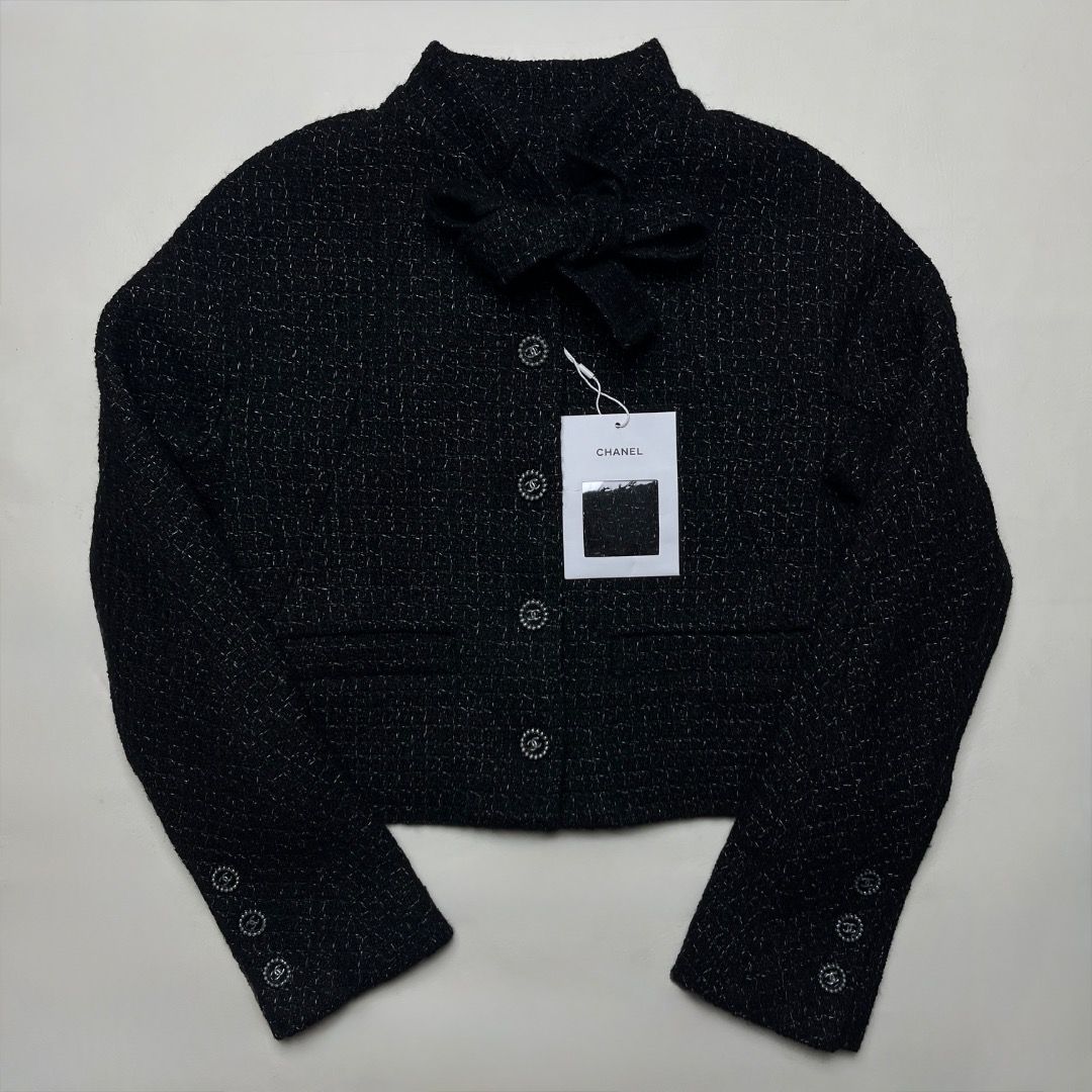 Chanel Black Tweed Bow Jacket Size 36 (Category: Coats, Jackets and Outerwear) located in Caloocan City. Submitted by achilles_grails (Listing ID 1470579156, Image 1). Description: - Features a chic high collar and built-in front bow tie detail - Signature pearl-rimmed CC logo buttons on the front and cuffs - Fully lined with luxurious black silk - Size: 36 - Condition: Brand new with tag attached - Perfect for formal events, workwear, or elevati