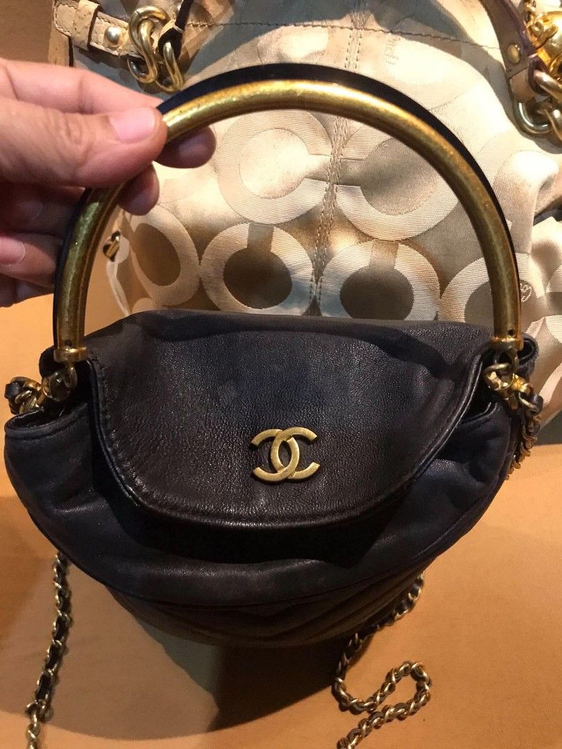 Chanel Chevron Quilted Leather Handbag with Chain Strap (Category: Shoulder Bags) located in Midsayap. Submitted by purse_gedo (Listing ID 1470668258, Image 3). Description: - Brand: Chanel - Material: Premium black leather with chic chevron quilting - Hardware: Elegant gold-tone CC logo - Design: Bucket style with drawstring closure and rigid metal top handle - Strap: Versatile chain and leather shoulder strap - Size: Compact and daily-wear frie