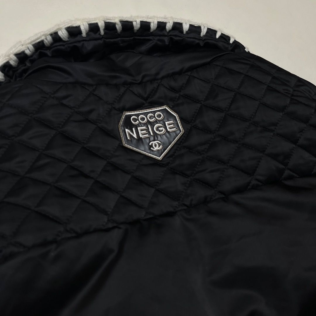 Chanel Coco Neige Black Down Puffer Jacket (Category: Coats, Jackets and Outerwear) located in Caloocan City. Submitted by achilles_grails (Listing ID 1470578345, Image 3). Description: - Brand: Chanel Coco Neige - Color: Classic Black with Contrast White Details - Design: Quilted upper shoulders, white contrast stitching, and plush white sherpa fleece collar - Branding: CC logo branded zipper pulls and snap buttons, plus Coco Neige shield patch 