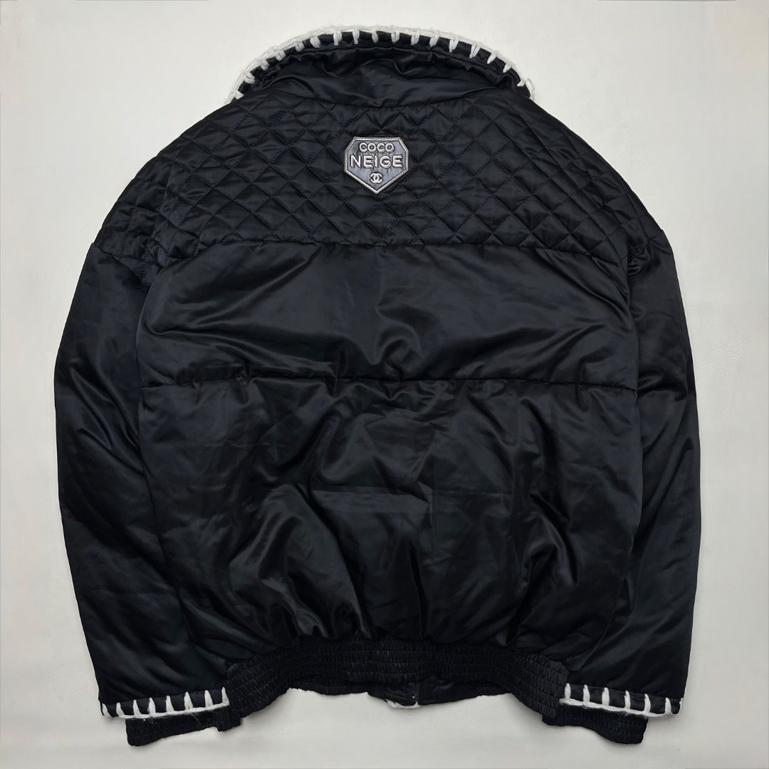 Chanel Coco Neige Black Down Puffer Jacket (Category: Coats, Jackets and Outerwear) located in Caloocan City. Submitted by achilles_grails (Listing ID 1470578345, Image 2). Description: - Brand: Chanel Coco Neige - Color: Classic Black with Contrast White Details - Design: Quilted upper shoulders, white contrast stitching, and plush white sherpa fleece collar - Branding: CC logo branded zipper pulls and snap buttons, plus Coco Neige shield patch 