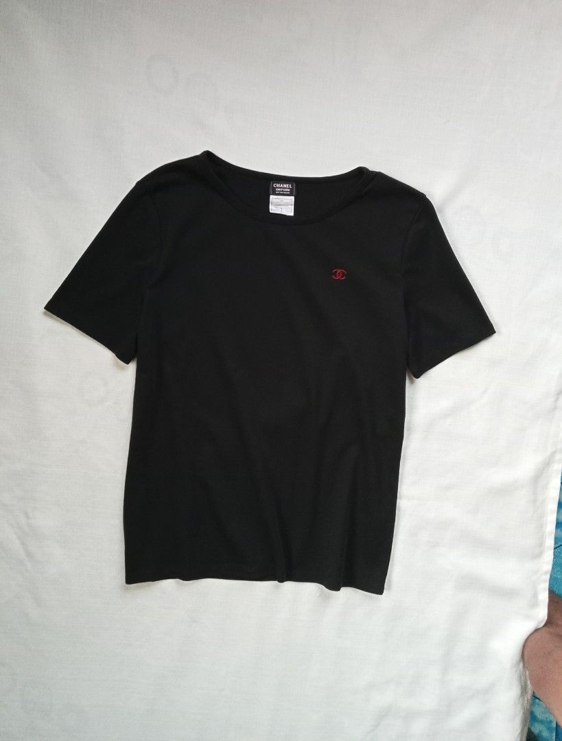 Chanel uniform black minimalist red CC Logo (Category: Shirts) located in Bagabag. Submitted by thrift_stories96 (Listing ID 1470705080, Image 1). Description: Chanel uniform black minimalist red CC Logo Large womens Length - 25 Width - 20 Condition - excellent Color and cloth - 9.5/10 No flaw.