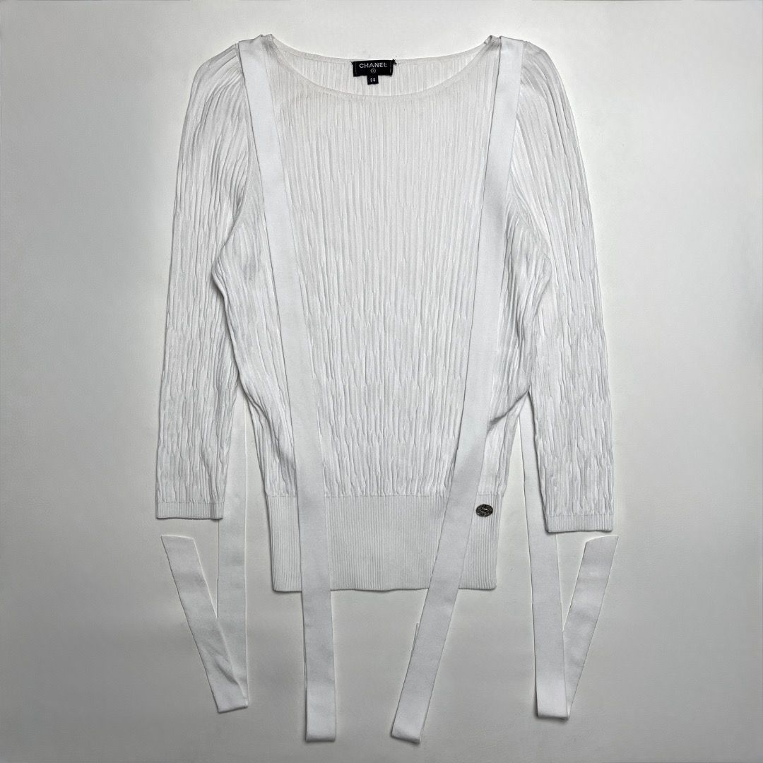 Chanel White Ribbed Knit Sweater Size 38 (Category: Longsleeves) located in Caloocan City. Submitted by achilles_grails (Listing ID 1470604062, Image 1). Description: - Brand: Chanel - Item: Ribbed knit sweater with hanging strap details - Color: White - Size: 38 (Made in Italy) - Material: Cupro and polyester blend - Condition: Pristine, brand new with tags intact - Features: Boat neckline, long sleeves, signature metal CC logo charm near the he