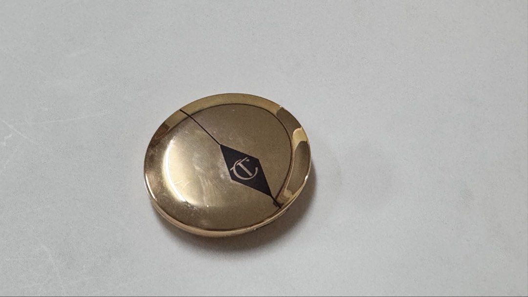 Charlotte Tilbury Magic Vanish Color Corrector Shade 2 Medium (Category: Makeup) located in Manila. Submitted by fcloset24 (Listing ID 1470581197, Image 1). Description: - Brand: Charlotte Tilbury - Product: Magic Vanish Color Corrector - Shade: 2 Medium - Size: Net weight 2.5g - Packaging: Shiny gold compact case with built-in mirror - Condition: Lightly used on the surface from previous applications, well-maintained.