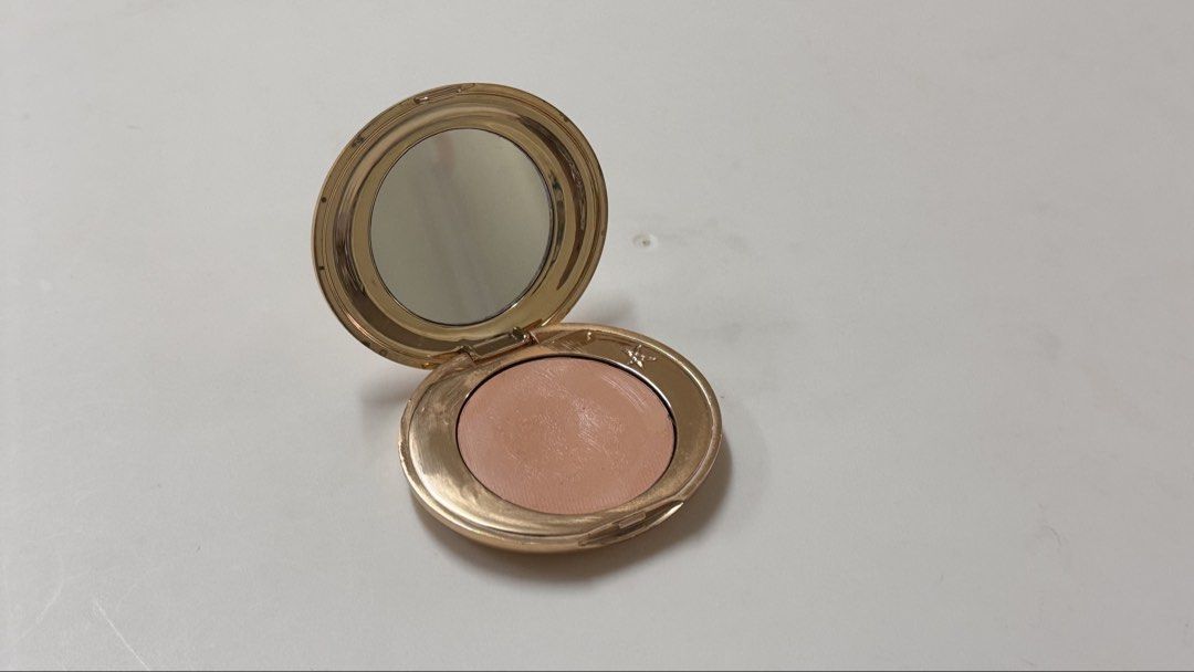 Charlotte Tilbury Magic Vanish Color Corrector Shade 2 Medium (Category: Makeup) located in Manila. Submitted by fcloset24 (Listing ID 1470581197, Image 2). Description: - Brand: Charlotte Tilbury - Product: Magic Vanish Color Corrector - Shade: 2 Medium - Size: Net weight 2.5g - Packaging: Shiny gold compact case with built-in mirror - Condition: Lightly used on the surface from previous applications, well-maintained.