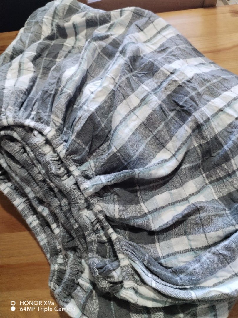 Checkered bedsheets ( Queen size) (Category: Bedding & Towels) located in Muntinlupa City. Submitted by arciagamaryann68 (Listing ID 1470609907, Image 1). Description: - Size: Queen - Design: Classic gray, white, and light blue checkered pattern - Fit: Fully gartered/fitted edges for a secure, slip-free mattress fit - Condition: Excellent, gently used - Material: Soft and comfortable fabric perfect for everyday use.