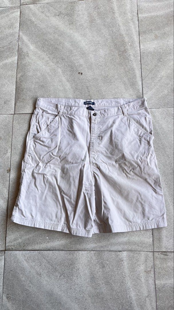 Cherokee beige canvas carpenter jorts size 40 (Category: Shorts) located in Cabuyao City. Submitted by bulandos (Listing ID 1470655765, Image 2). Description: - Brand/Model: Cherokee Utility Shorts - Color: Light Beige - Size: Waist 40 - Material: 100% Cotton (Made in Egypt) - Features: Multiple pockets and side utility loop - Care: Machine washable - Flaw: Small stain near the lower leg hem.