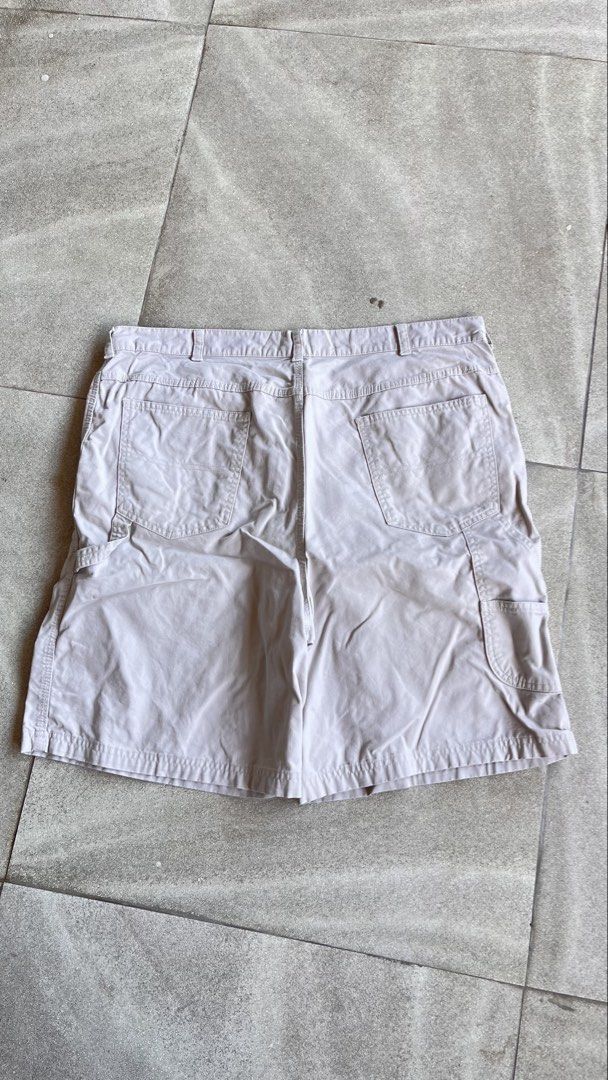 Cherokee beige canvas carpenter jorts size 40 (Category: Shorts) located in Cabuyao City. Submitted by bulandos (Listing ID 1470655765, Image 1). Description: - Brand/Model: Cherokee Utility Shorts - Color: Light Beige - Size: Waist 40 - Material: 100% Cotton (Made in Egypt) - Features: Multiple pockets and side utility loop - Care: Machine washable - Flaw: Small stain near the lower leg hem.