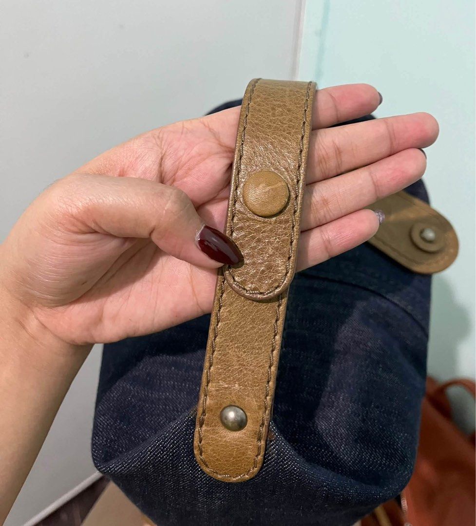 Chloé Denim and Leather Shoulder Bag (Category: Luxury Bags & Wallets) located in Bustos. Submitted by theprelovedshopbulacan (Listing ID 1470704391, Image 2). Description: - Authentic Chloé shoulder bag - Dark blue denim with brown leather trim - Debossed Chloé logo on bottom panel - Single brown leather strap with snap button detail - Metallic zip closure with dual leather pull tabs - Clean cream fabric lining - Vintage-finish hardware - PM for