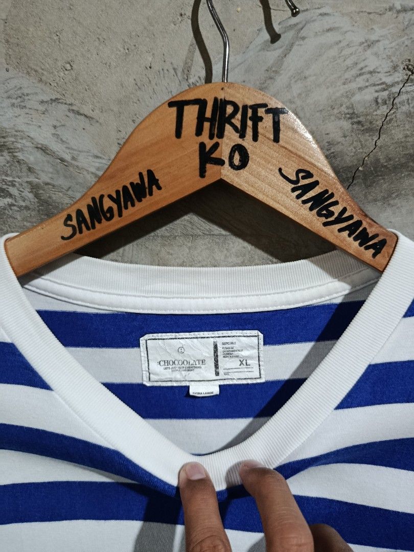 :CHOCOOLATE Blue White Striped T-Shirt XL (Category: Tshirts & Polo Shirts ) located in Kalamansig. Submitted by skone1996 (Listing ID 1470558167, Image 2). Description: - Brand::CHOCOOLATE - Size: XL - 21 Width - 28 Length - 9.8/10 Color rate - No issue - Color: Blue and white horizontal stripes - Design: Short sleeves, crew neck, rubberized brand patch on chest, woven label near lower hem - Condition: Clean fabric with interior collar and care 
