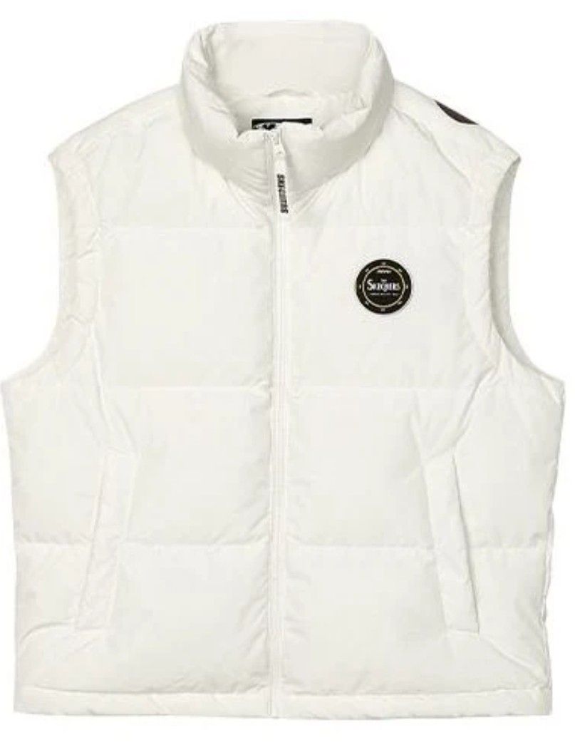 CHOCOOLATE White Puffer Vest Size S (Category: Sleeveless) located in Quezon City. Submitted by epoquebyjaz (Listing ID 1470620726, Image 1). Description: - Brand::CHOCOOLATE - Color: Off-white with black inner lining - Size: Small - Length: Approx. 24.5 inches - Features: Zip-up front, high collar, chest zip pocket, and two lower snap-flap pockets - Details: CHOCOOLATE graphic patch and branded circle patch - Condition: Excellent pre-loved condi