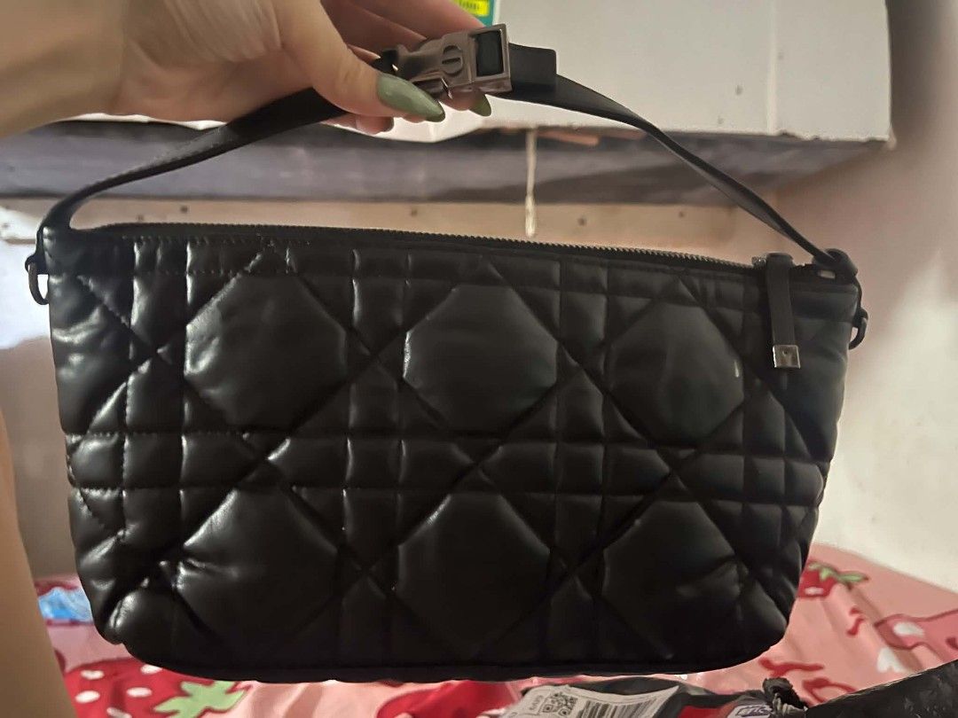 Christian Dior (Category: Clutches) located in Manila. Submitted by jjm-collections (Listing ID 1470727093, Image 3). Description: - Brand: Christian Dior - Model: DiorTravel Nomad Pouch - Material: Black quilted lambskin leather with Cannage pattern - Hardware: Silver-tone with CD zipper pull - Closure: Top zip closure - Strap: Adjustable leather shoulder strap - Interior: Black fabric lining with Christian Dior Made in Italy leather patch tag a