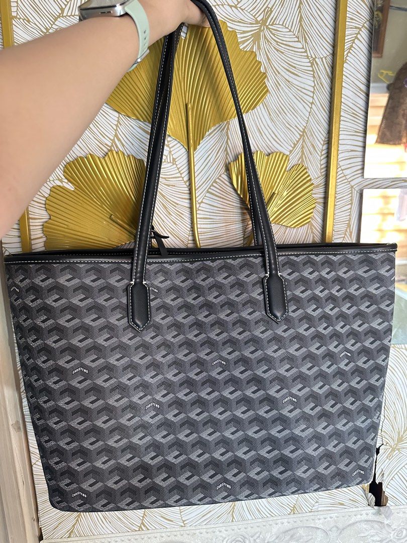 Christyng Russo Monogram Large Bag (Category: Tote Bags) located in Valenzuela. Submitted by _minchin (Listing ID 1470631750, Image 1). Description: Authentic Christy Ng tote bag - Comes with a matching pouch - Dust bag included - Used few times (check strap) -no visible dents -fits 14” laptop.
