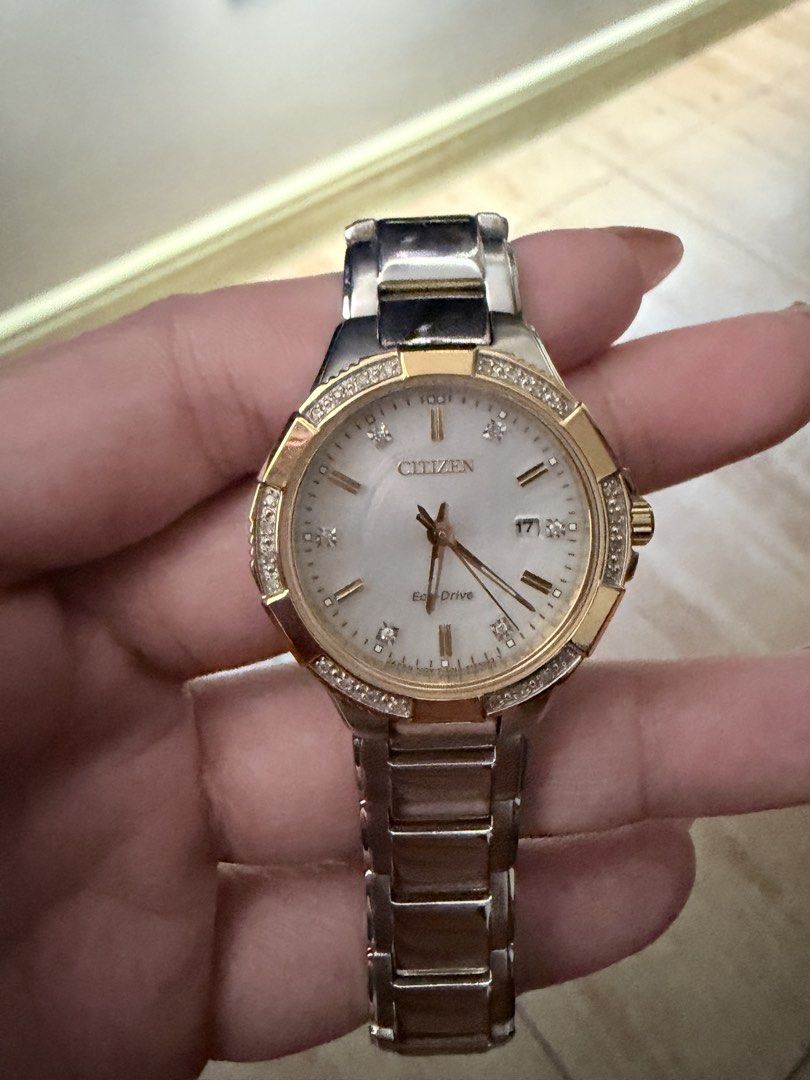 Citizen Eco-Drive Two-Tone Diamond Watch (Category: Women's Watches) located in Quezon City. Submitted by teeps_10 (Listing ID 1470674210, Image 1). Description: - Brand: Citizen Eco-Drive - Design: Two-tone silver and gold stainless steel with crystal bezel accents - Dial: Mother-of-pearl dial featuring diamond hour markers and a date window near 3 o'clock - Power Source: Eco-Drive technology (powered by light, no battery replacement needed) - C