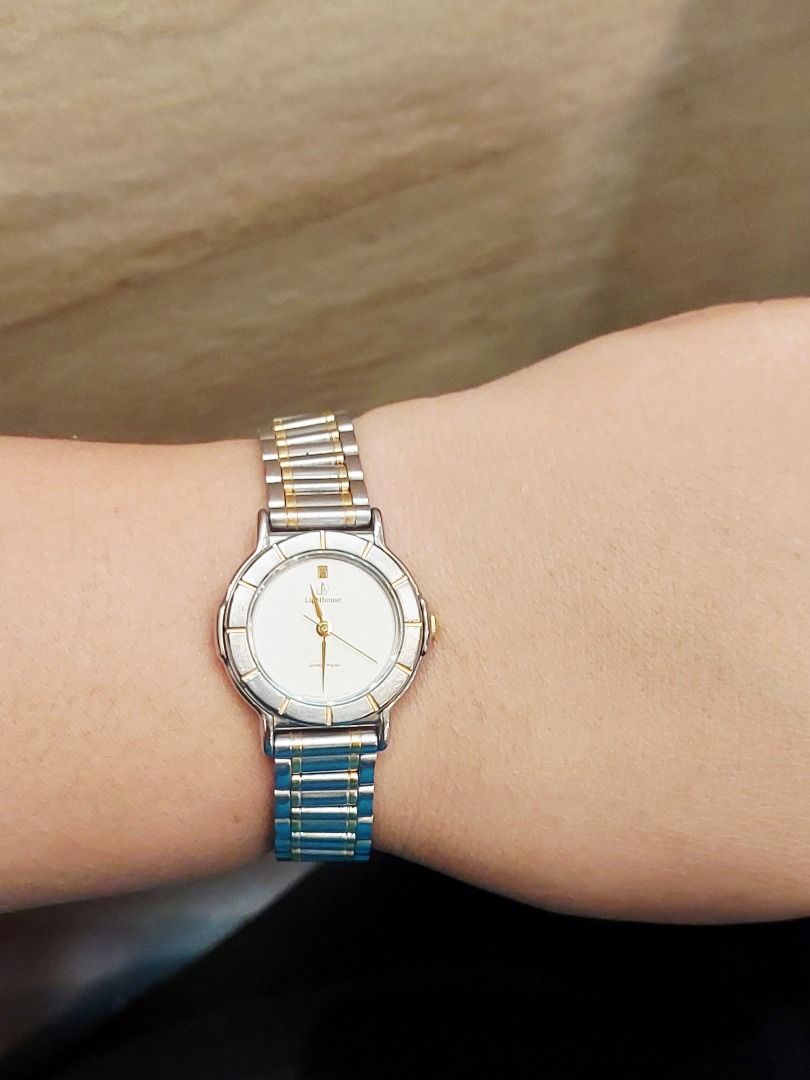 Citizen Lighthouse Two-Tone Analog Watch (Category: Women's Watches) located in Batangas. Submitted by vintageanddainty (Listing ID 1470583402, Image 3). Description: - Brand: Citizen - Design: Two-tone silver and gold stainless steel bracelet - Dial: Round white dial with elegant gold-tone hands and hour markers - Bezel: Textured design with alternating silver and gold segments - Fit: Standard wrist size - Style: Classic and versatile everyday a