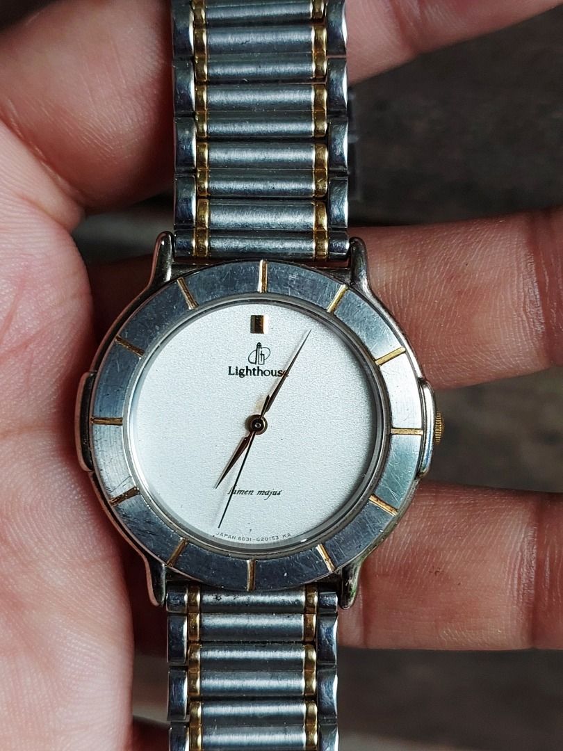 Citizen Lighthouse Two-Tone Quartz Watch (Category: Women's Watches) located in Batangas. Submitted by vintageanddainty (Listing ID 1470590567, Image 2). Description: - Brand: Citizen Lighthouse - Movement: Quartz (battery status unknown) - Dial: White with gold-tone hour marker at 12 o'clock - Bezel: Round with metallic markers, shows minor signs of wear - Case: Shows light signs of wear - Bracelet: Comfortable two-tone silver and gold stainless