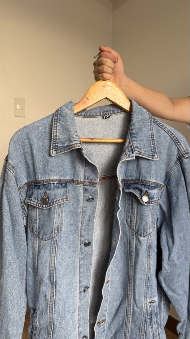 Classic Light Blue Denim Jacket (Category: Coats, Jackets and Outerwear) located in Quezon City. Submitted by cristealyanna (Listing ID 1470563791, Image 2). Description: - Style: Classic collar light wash denim jacket - Fit: Regular fit, great for layering over tees and hoodies - Features: Button-up front and functional chest pockets - Season: Perfect for cooler weather.