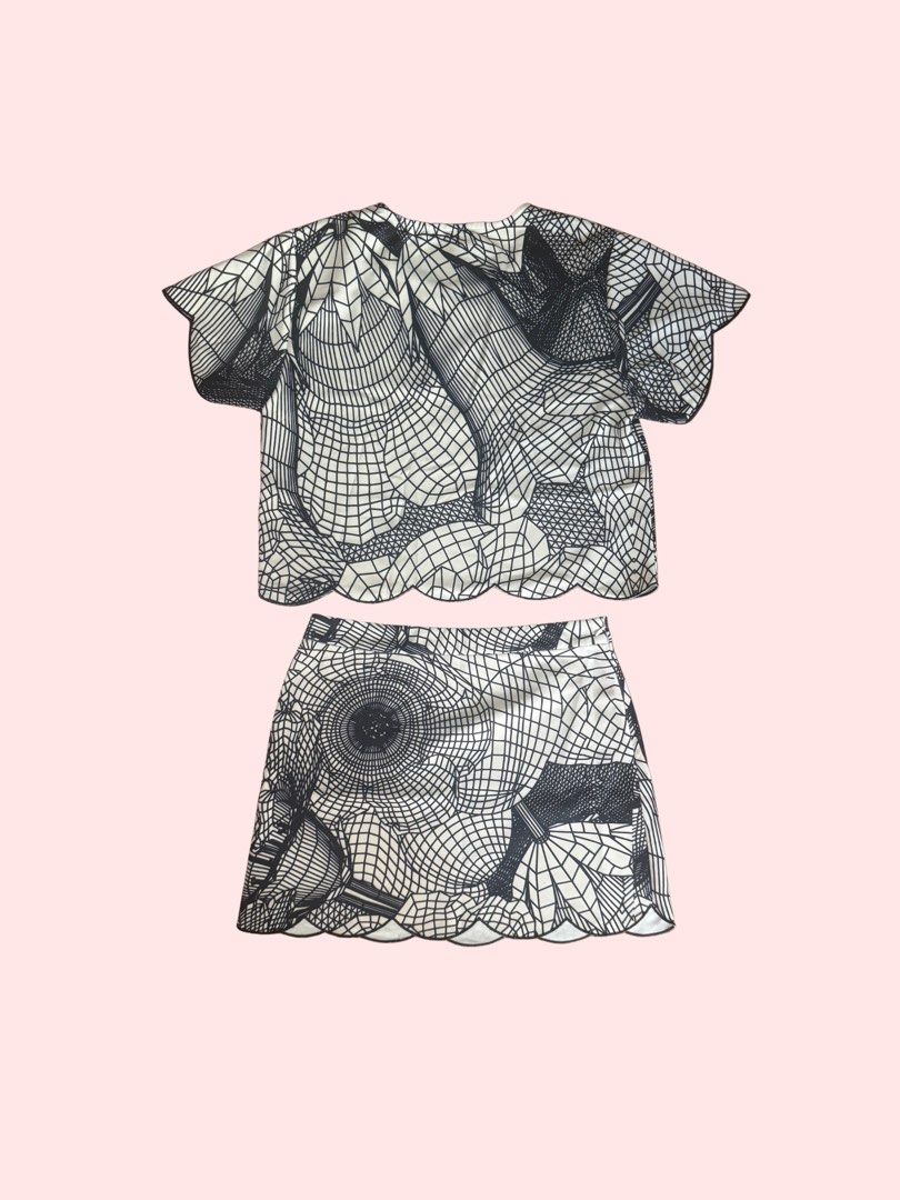 Classy Top and Skirt Set (Category: Sets or Coordinates) located in Pasig City. Submitted by kia.sell (Listing ID 1470651421, Image 2). Description: - Brand: Marui / OIOI Japan (100% Authentic) - Style: Matching 2-piece coordinate crop top and mini skirt set - Color: Monochrome Black & Off-White - Design Details: Unique 3D abstract grid/floral graphic print, short-sleeve top, high-waisted A-line mini skirt, and elegant contrast laser-cut scallope