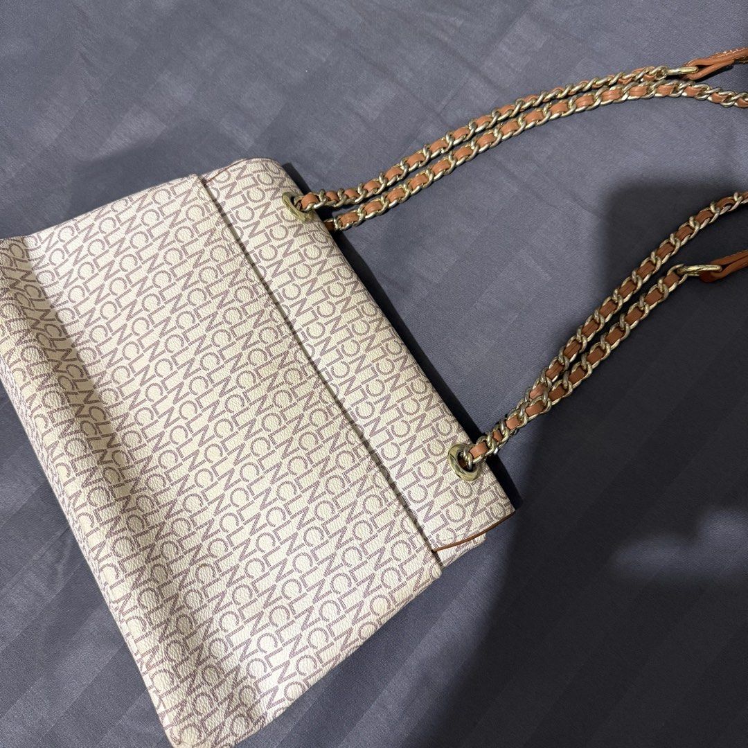 CLN Shoulder Bag (Category: Shoulder Bags) located in Talisay. Submitted by senttyy (Listing ID 1470646270, Image 2). Description: - Brand: CLN - Design: All-over monogram pattern in chic beige and brown - Hardware: Elegant gold-tone with a floral twist-lock closure - Strap: Interwoven chain and leather shoulder strap - Interior: Multiple compartments with a secure zippered middle section and logo-print fabric lining - Condition: Noticeable crack