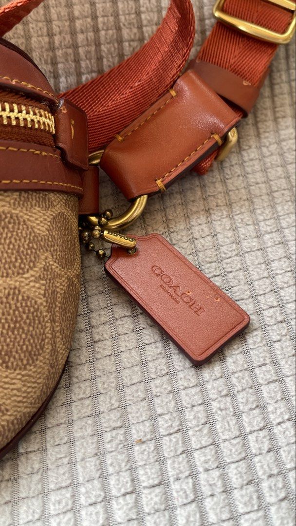 Coach Belt Bag (Category: Luxury Bags & Wallets) located in Manila. Submitted by xyrilleprix (Listing ID 1470632296, Image 2). Description: - Authentic Coach belt bag in brown signature canvas and smooth leather Bought in SG for SGD 325 - Front zip pocket and durable brass hardware with matching leather hangtag - Adjustable orange web strap with a secure buckle - Solid brown leather back side loc/meetup: Tagaytay.