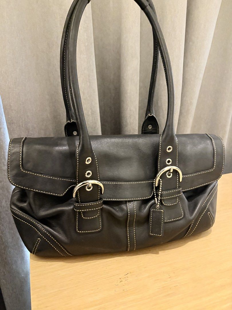 Coach Black Leather 9636 (Category: Luxury Bags & Wallets) located in Manila. Submitted by sophiaalex70506 (Listing ID 1470566331, Image 3). Description: - Brand: Coach - Material: Genuine black cowhide leather with contrast white stitching - Hardware: Silver-tone with dual buckle front flap closure - Straps: Double shoulder straps - Interior: Coach signature fabric lining with zippered pocket and creed patch - Extras: Original hangtag included -
