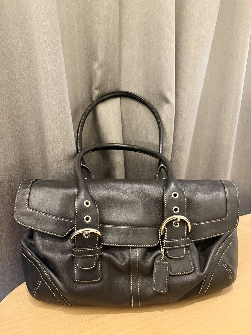 Coach Black Leather 9636 (Category: Luxury Bags & Wallets) located in Manila. Submitted by sophiaalex70506 (Listing ID 1470566331, Image 2). Description: - Brand: Coach - Material: Genuine black cowhide leather with contrast white stitching - Hardware: Silver-tone with dual buckle front flap closure - Straps: Double shoulder straps - Interior: Coach signature fabric lining with zippered pocket and creed patch - Extras: Original hangtag included -
