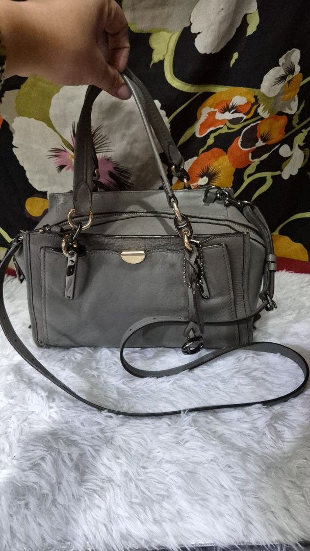 Coach Grey Leather Crossbody Shoulder Bag (Category: Looking For) located in Baguio. Submitted by jhaz_bags (Listing ID 1470680835, Image 1). Description: - Authentic Coach leather handbag in chic grey - Dual top handles and adjustable shoulder strap for versatile wear - Front exterior pocket with elegant gold-tone hardware - Secure dual zipper top closure with branded metal pull tabs - Signature Coach hangtag included - Fully lined interior - Co