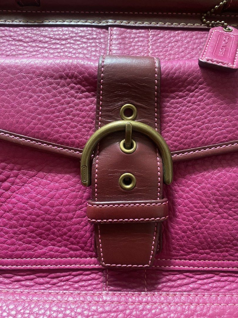 Coach Leather Handbag Pink Burgundy (Category: Luxury Bags & Wallets) located in Manila. Submitted by anthony1723 (Listing ID 1470697285, Image 3). Description: - Brand: Coach - Color: Pink and Burgundy - Material: Genuine leather with antique brass hardware - Exterior: Front pocket with buckle closure and metal turnlocks, double leather handles, and hanging tag - Interior: Pink monogram fabric lining with secure zipper closure - Authenticity: In