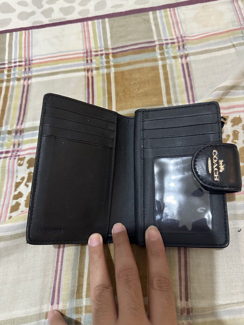Coach Medium Corner Zip Signature Wallet (Category: Luxury Bags & Wallets) located in Bugallon. Submitted by lavenderlane (Listing ID 1470628698, Image 3). Description: - Brand: Coach - Material: Brown signature coated canvas with dark interior lining - Closure: Snap closure with gold-tone hardware and front embossed logo - Compartments: Multiple card slots, ID window, and full-length bill compartment - Coin Pocket: Convenient zipped coin pocket 
