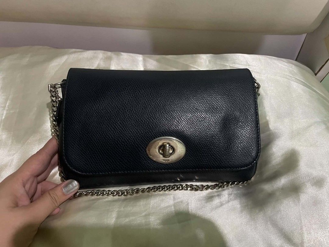 Coach Mini Ruby Navy blue leather crossbody Shoulder bag pre-owned (Category: Purses & Pouches) located in Legazpi City. Submitted by treasurebonbon (Listing ID 1470712652, Image 3). Description: Coach Mini Ruby navy blue Leather Crossbody Shoulder Bag Pre-Owned Coach Mini Ruby black leather 3-way shoulder bag with removable chain strap and leather strap. Can be worn as crossbody, handbag, or clutch. Item Details Brand: Coach Material: Leather Co