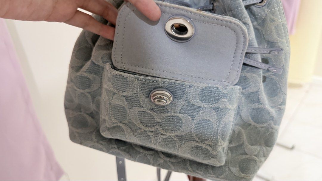 Coach Riya 21 Backpack in Washed Denim (Category: Luxury Bags & Wallets) located in Manila. Submitted by hautology (Listing ID 1470646085, Image 2). Description: Coach Riya 21 / Mini in Washed Denim - Comes with the dust bag and receipts (lost leather tag) - barely used and in good condition - Slight yellowing in the sides and edges - No tears Negotiable .