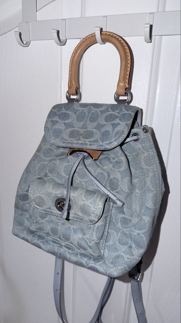 Coach Riya 21 Backpack in Washed Denim (Category: Luxury Bags & Wallets) located in Manila. Submitted by hautology (Listing ID 1470646085, Image 1). Description: Coach Riya 21 / Mini in Washed Denim - Comes with the dust bag and receipts (lost leather tag) - barely used and in good condition - Slight yellowing in the sides and edges - No tears Negotiable .