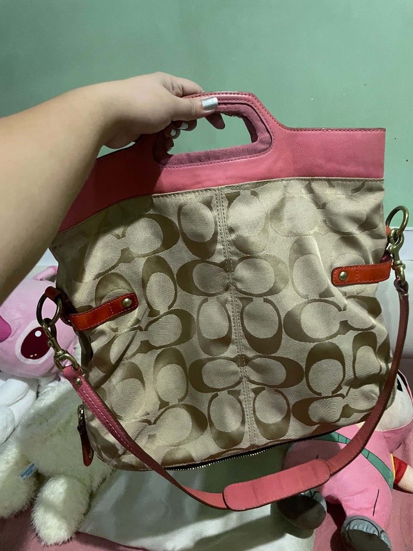 COACH Signature 2-Way Shoulder Bag (Category: Shoulder Bags) located in Legazpi City. Submitted by treasurebonbon (Listing ID 1470683504, Image 3). Description: This is a Coach bag. It's not in very good condition. Please check the photos from the third image onwards for scratches and stains. The pink vinyl part is a little sticky, and there's a slight musty smell inside the bag. Only the bag will be shipped (the white bag is not included). Pleas