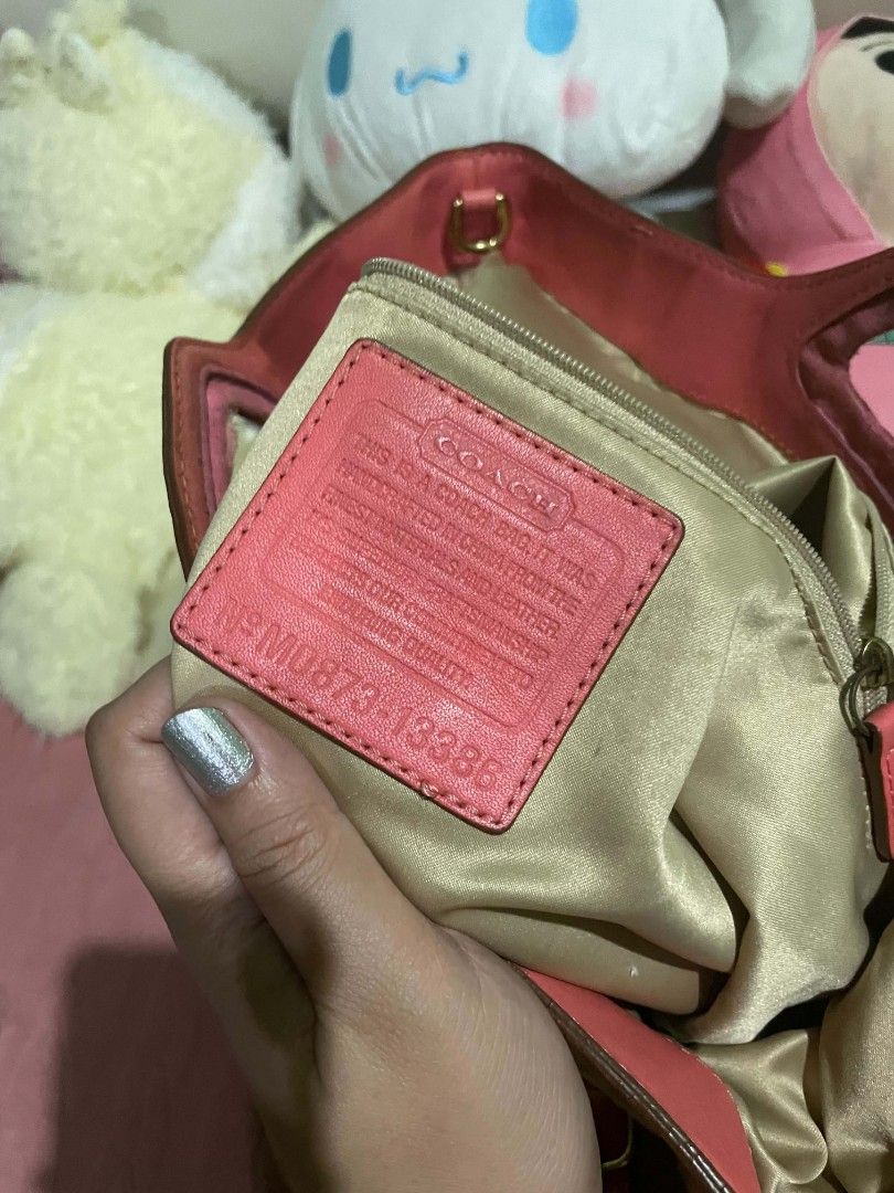 COACH Signature 2-Way Shoulder Bag (Category: Shoulder Bags) located in Legazpi City. Submitted by treasurebonbon (Listing ID 1470683504, Image 2). Description: This is a Coach bag. It's not in very good condition. Please check the photos from the third image onwards for scratches and stains. The pink vinyl part is a little sticky, and there's a slight musty smell inside the bag. Only the bag will be shipped (the white bag is not included). Pleas