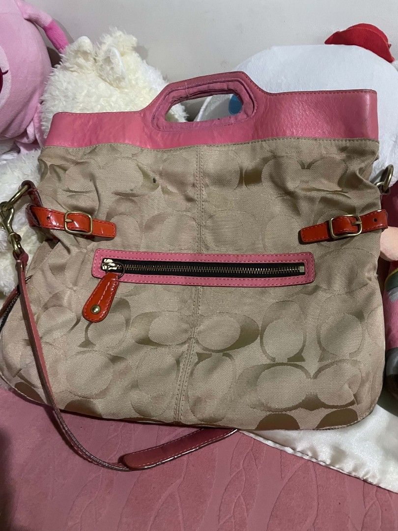 COACH Signature 2-Way Shoulder Bag (Category: Shoulder Bags) located in Legazpi City. Submitted by treasurebonbon (Listing ID 1470683504, Image 1). Description: This is a Coach bag. It's not in very good condition. Please check the photos from the third image onwards for scratches and stains. The pink vinyl part is a little sticky, and there's a slight musty smell inside the bag. Only the bag will be shipped (the white bag is not included). Pleas