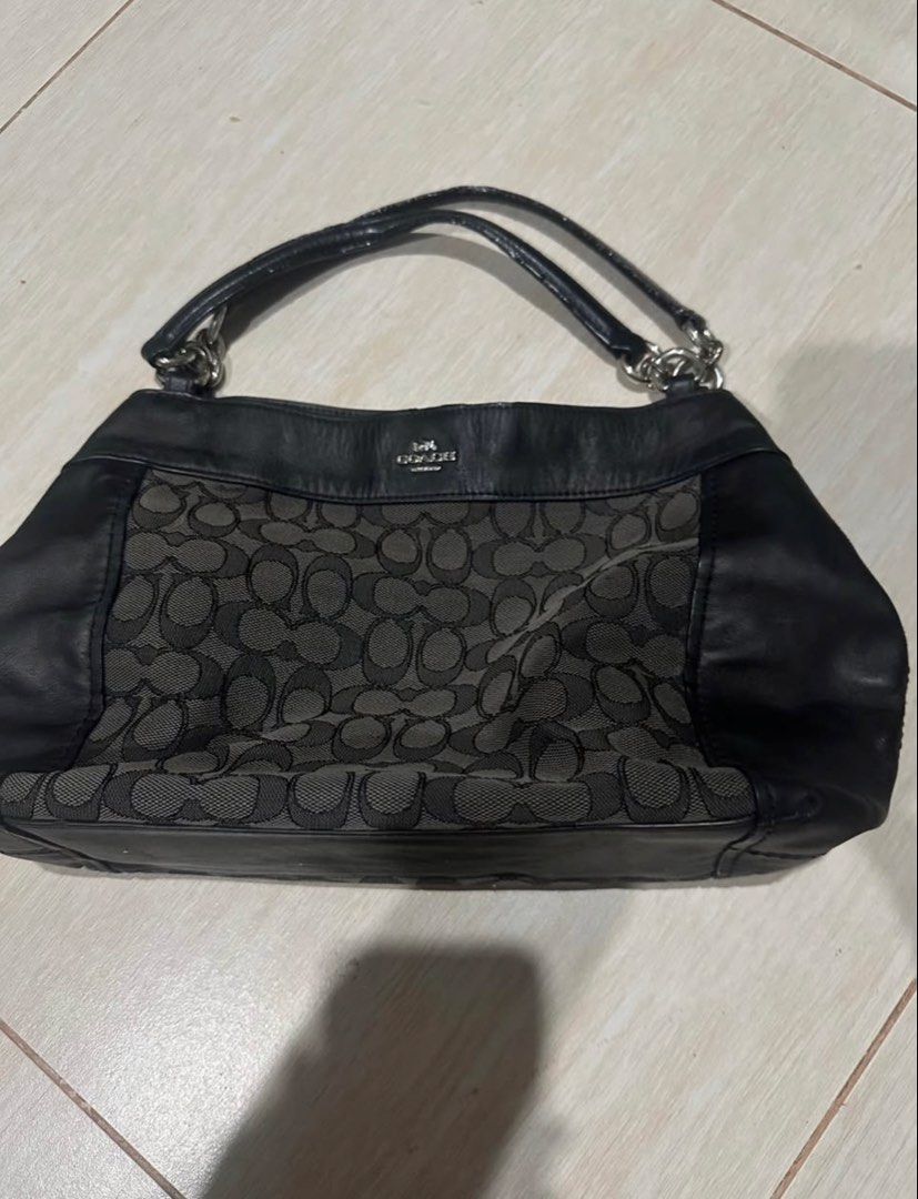 Coach Signature C Black Shoulder Bag (Category: Luxury Bags & Wallets) located in Manila. Submitted by zayzay08 (Listing ID 1470728435, Image 1). Description: - Brand: Coach - Material: Signature monogram fabric and leather - Color: Classic Black with Silver hardware - Straps: Double strap design with chic chain ring links - Closure: Secure zip-top plus magnetic snap closure - Interior: Includes a zippered pocket, slip compartments, and official 