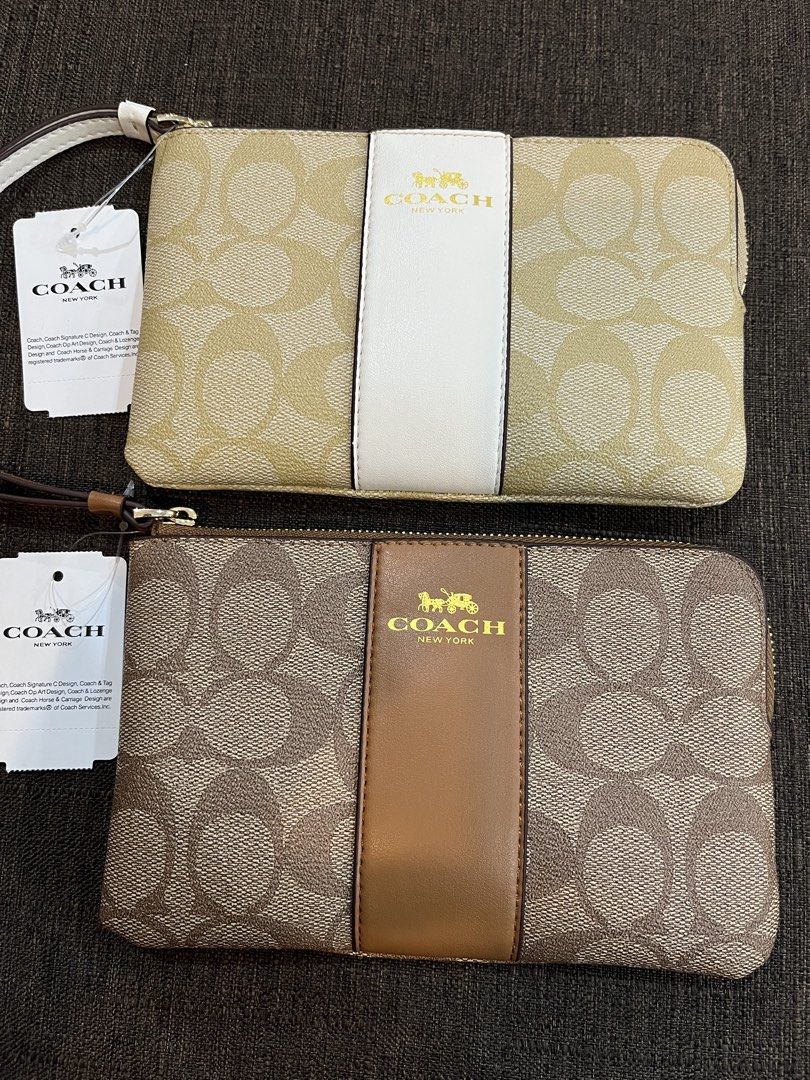 Coach Signature C Stripe Wristlet (Bundle) (Category: Luxury Bags & Wallets) located in Baguio. Submitted by elcie.08 (Listing ID 1470628076, Image 1). Description: - Brand new with tags attached - Coach signature C canvas with stylish center stripe - Secure zip-top closure with a convenient wrist strap - Interior fabric lining complete with built-in credit card slots - Compact and versatile for everyday use or gifting - ₱ 2,000 for both.