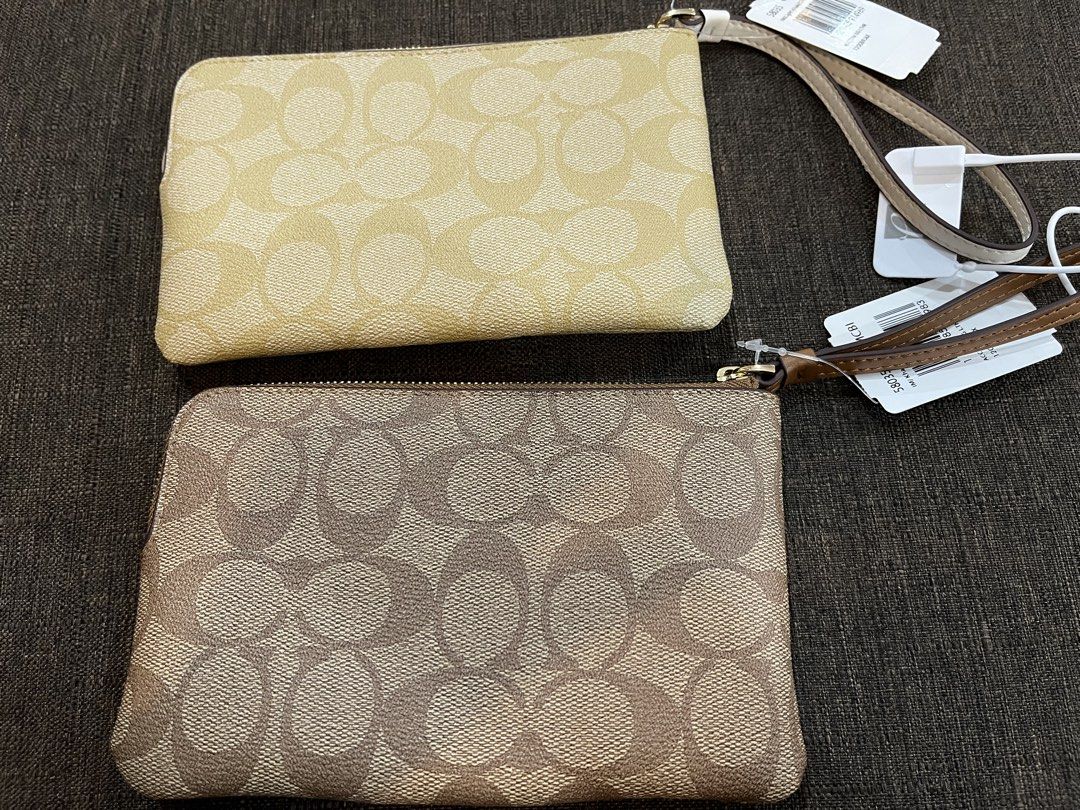 Coach Signature C Stripe Wristlet (Bundle) (Category: Luxury Bags & Wallets) located in Baguio. Submitted by elcie.08 (Listing ID 1470628076, Image 2). Description: - Brand new with tags attached - Coach signature C canvas with stylish center stripe - Secure zip-top closure with a convenient wrist strap - Interior fabric lining complete with built-in credit card slots - Compact and versatile for everyday use or gifting - ₱ 2,000 for both.