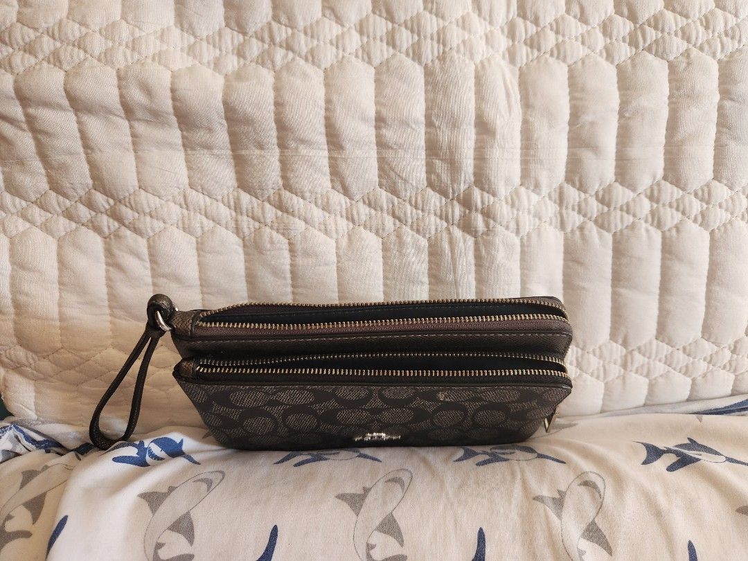 Coach Signature Double Zip Wristlet (Category: Luxury Bags & Wallets) located in Talisay. Submitted by chedz38 (Listing ID 1470610336, Image 3). Description: *Pearlized Signature coated canvas and metallic crossgrain leather *Eight credit card slots *Two separate zipped main compartments with clean fabric lining * Wrist strap attached *8" (L) x 4 3/4" (H) x 1" (W) Silver-tone hardware and Coach New York metal logo badge * Fits all phone sizes up 
