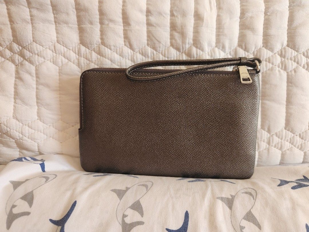 Coach Signature Double Zip Wristlet (Category: Luxury Bags & Wallets) located in Talisay. Submitted by chedz38 (Listing ID 1470610336, Image 2). Description: *Pearlized Signature coated canvas and metallic crossgrain leather *Eight credit card slots *Two separate zipped main compartments with clean fabric lining * Wrist strap attached *8" (L) x 4 3/4" (H) x 1" (W) Silver-tone hardware and Coach New York metal logo badge * Fits all phone sizes up 