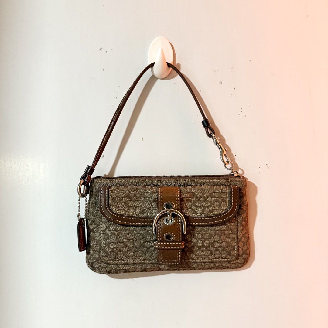 Coach Soho Signature Wrislet (Category: Luxury Bags & Wallets) located in Cavite. Submitted by vintage.bratz (Listing ID 1470601663, Image 1). Description: • Authentic Coach • Overall in good condition.
