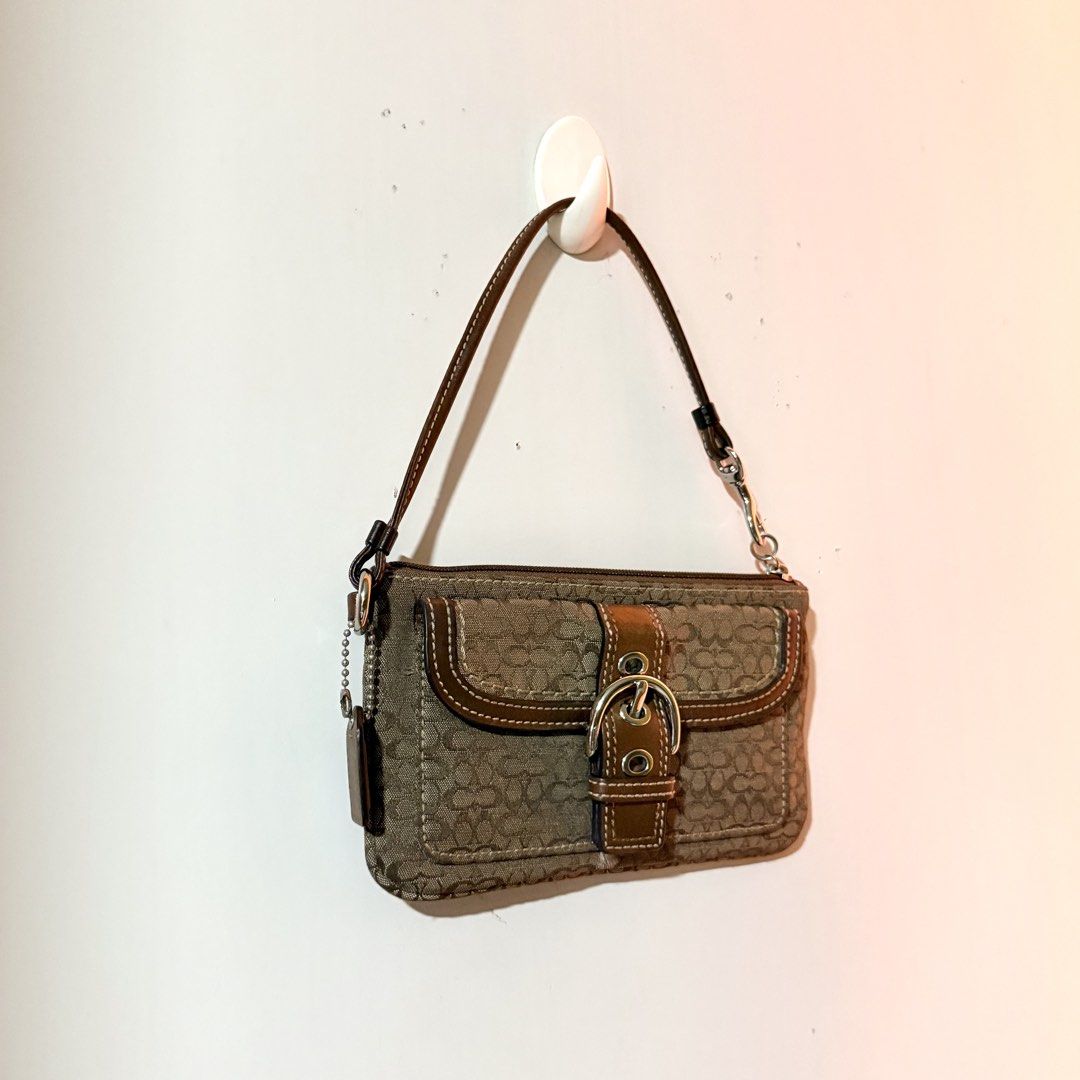 Coach Soho Signature Wrislet (Category: Luxury Bags & Wallets) located in Cavite. Submitted by vintage.bratz (Listing ID 1470601663, Image 2). Description: • Authentic Coach • Overall in good condition.