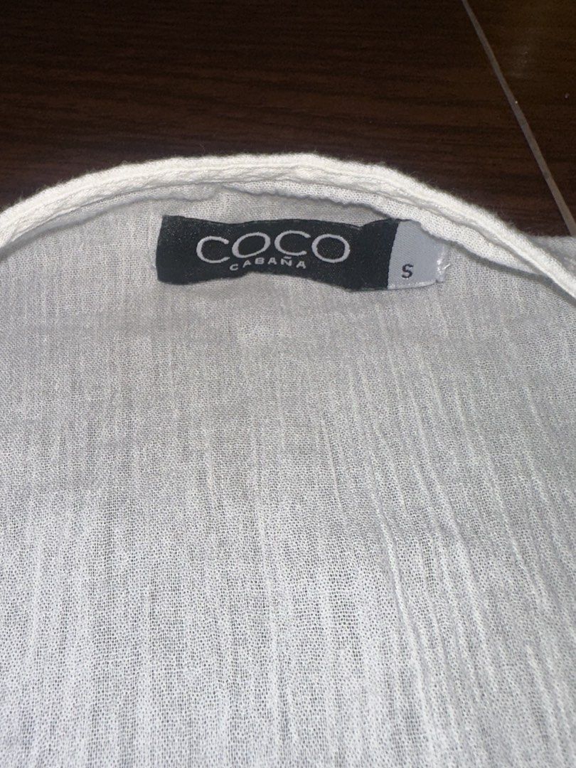 Coco Cabana White Tie-Front Short Sleeve Blouse Size S (Category: Blouses) located in Antipolo. Submitted by yhbc08 (Listing ID 1470610348, Image 2). Description: RFS: declutter✨ ✅Brand: Coco Cabana ✅Size: S ✅Color: White (Neutral) ✅Material: Lightweight gauze ✅Features: Short sleeves, open neckline, wrap-around waist tie ✅Perfect for: Swimwear cover-up or styling with high-waisted shorts.