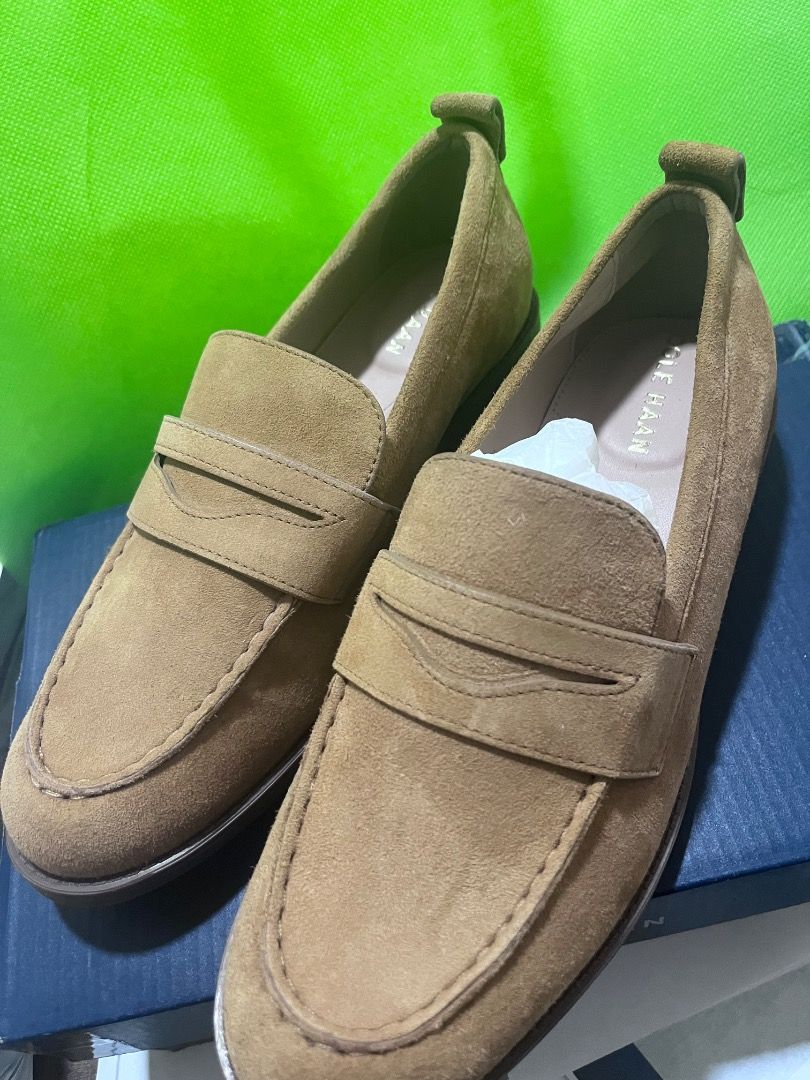 Cole Haan Suede Penny Loafers (Category: Loafers) located in Taguig. Submitted by jovina1994 (Listing ID 1470558376, Image 2). Description: - Brand: Cole Haan - Style: Classic slip-on penny loafer with traditional strap detail - Color: Camel brown - Material: Clean, textured suede - Features: Round toe silhouette, flat sole with a small heel - Inclusions: Original blue Cole Haan box - Condition: brand new.